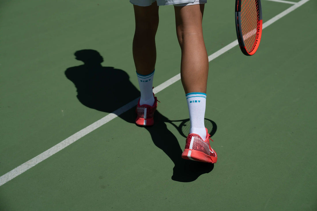 Should I wear thicker socks when playing tennis? Men's retro court tennis socks on court.